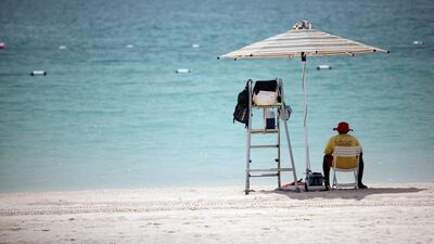 A life guard on the Corniche Beach in Abu Dhabi. Sammy Dallal / The National