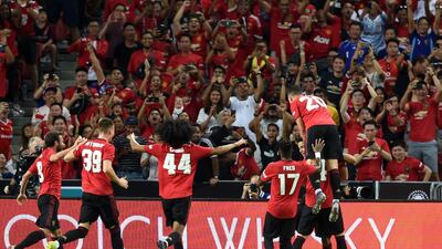 United players celebrate Greenwood's winner. AFP