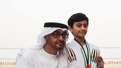 Sheikh Mohammed bin Zayed, Crown Prince of Abu Dhabi and Deputy Supreme Commander of the Armed Forces, greets a young jiu-jitsu winner during a Sea Palace barza. Ryan Carter / Crown Prince Court — Abu Dhabi