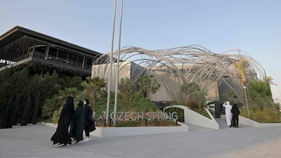 Visitors walk by the Czech Republic pavilion at Expo 2020 Dubai. AFP