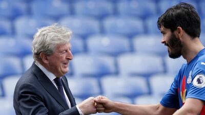 Roy Hodgson, manager of Crystal Palace, celebrates victory with James Tomkins. Getty