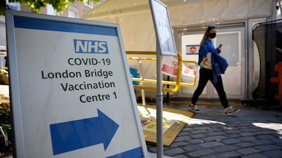 People leave the London Bridge Vaccination Centre after receiving doses of the Covid-19 vaccine. AFP