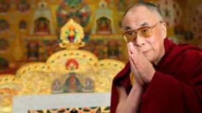 The Dalai Lama greets journalists in Dharamsala yesterday.