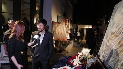 Manny Pacquiao attends a silent auction last year in Los Angeles, where he donated the boxing kit he wore against Timothy Bradley to raise funds for Typhoon Yolanda victims. Mike YOung for The National / April 15, 2014