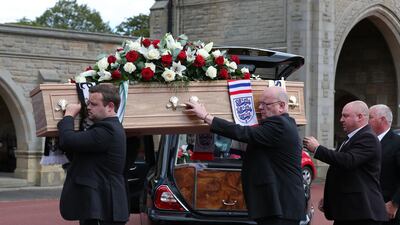 The coffin of British football legend Jack Charlton is carried into the West Road Crematorium on Tuesday. AFP