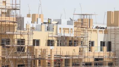 Weak demand in the market was prompting property developers to slow down construction and complete fewer homes than predicted. Jeffrey E Biteng / The National