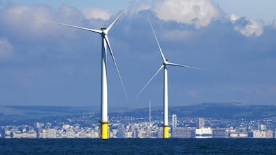 Wind turbines dominate the skyline off the coast of Brighton. The Confederation of British Industry says UK businesses can help to sustain the country's reputation as a global leader in offshore wind and the wider renewable energy sector. Getty Images