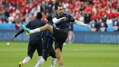 France defender Adil Rami warms up before the game. Pascal Rossignol / Reuters