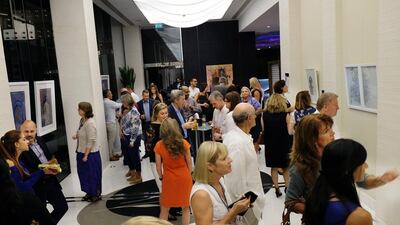 Several art enthusiasts gathered at the Fairmont Bab Al Bahr in Abu Dhabi for the opening reception of the "No White Walls" annual art show. Delores Johnson / The National