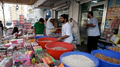 People shop for sweets, nuts and other items for Hag al Leila at the old city in Ras al Khaimah. The annual one-day Islamic festival for children is a lucrative time for merchants.