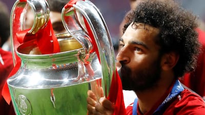 Liverpool's Mohamed Salah kisses the Champions League trophy after beating Tottenham 2-0 in the final in Madrid on June 1, 2019. Reuters