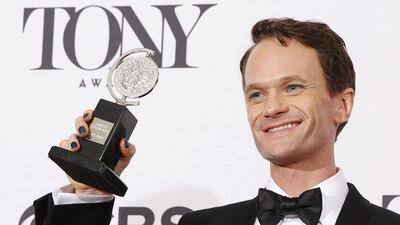 Neil Patrick Harris poses backstage with his Tony Award for Best Performance by an Actor in a Leading Role in a Musical for Hedwig and the Angry Inch. Reuters