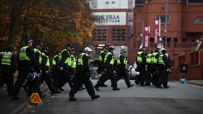 Police officers outside Villa Park. AFP