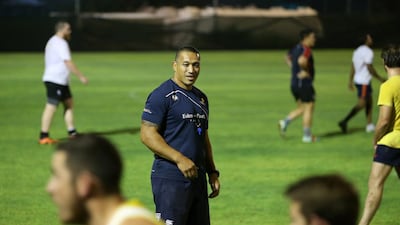 Apollo Perelini gives instruction to the UAE national rugby team during a training session in Dubai. Pawan Singh / The National