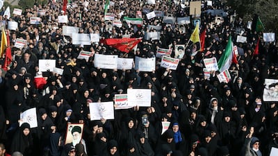Iranian protesters chant slogans at a rally in Tehran, Iran. The Trump administration is calling on Iran's government to stop blocking Instagram and other popular social media sites as Iranians demonstrate in the streets. Ebrahim Noroozi / AP Photo.