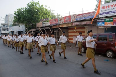 The New Delhi contingent of the RSS takes to the streets with sticks in hand to mark the anniversary of the party's foundation. J Adam Huggins for The National