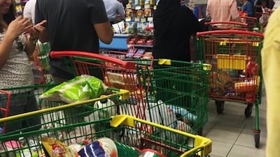 People rushing to buy food supplies at a supermarket in Doha, Qatar on June 5, 2017. Arab nations including the UAE and Saudi Arabia cut diplomatic ties with Qatar, further deepening a rift between Gulf Arab nations over Doha's support for Islamist groups. @shalome05 via AP