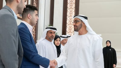 Sheikh Mohamed bin Zayed meets the top performing pupils of the year and their parents at Al Bateen Palace. Rashed Al Mansoori / Ministry of Presidential Affairs