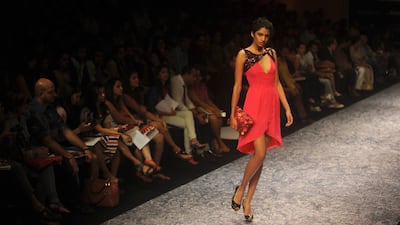 August 18, 2011: A model showcases a creation by Indian designer Nachiket Barve on the second day of Lakme Fashion Week (LFW) Winter/Festive 2011 in Mumbai. AFP PHOTO/Punit PARANJPE