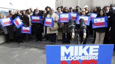 Supporters if Michael Bloomberg wait for him to arrive at a campaign stop in New York.