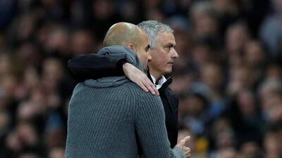 Manchester City manager Pep Guardiola with Manchester United manager Jose Mourinho after the match. Reuters