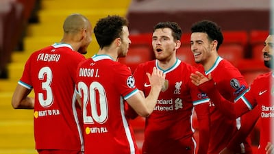 Curtis Jones celebrates with teammates after scoring against Ajax. AFP