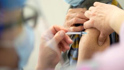 A Canadian receives the vaccine against Covid-19 at a clinic in Laval, Quebec, on February 25, 2021. Reuters