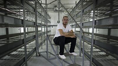 Palestinian Mahmoud Kuhail inside one of the empty growing rooms of the Amoro mushroom farm located in the Palestinian city of Jericho on September 18,2016. Mahmoud says that his farm has been closed since June because his supplies, including compost have been held up in the Israeli port of Ashdod since June. (Heidi Levine for The National).