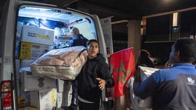 Residents load a van after a fundraising campaign and collection of aid supplies for earthquake victims in The Netherlands. EPA