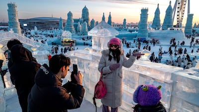 Visitors at the Harbin International Ice and Snow Festival in Harbin, Heilongjiang Province, China. Bloomberg