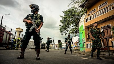 Sri Lankan security forces enforce a cordon while a bomb disposal unit works near the St Anthony Church, April 22, 2019. Jack Moore / The National.