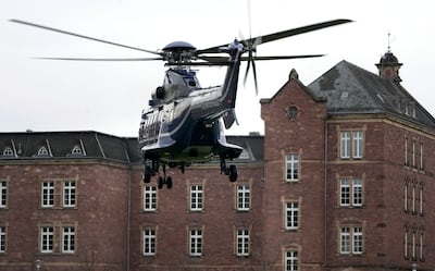 A police helicopter lands near federal prosecutors' headquarters in Karlsruhe. AP
