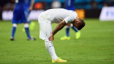 Jack Wilshere hangs his head in dejection after England lose 2-1 to Italy in their Group D opener at the 2014 World Cup on Saturday. Christopher Lee / Getty Images