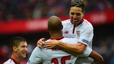 Samir Nasri, right, and Sevilla will be aiming to end Real Madrid's unbeaten run which currently stands at 39 matches. Cristina Quicler / AFP