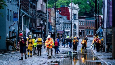 Rescue personnel examine damage on Main Street after a flash flood rushed through the historic town of Ellicott City, Maryland, USA, 27 May 2018. The National Weather Service stated as much as 9.5 inches of rain fell in the area. Jim Lo Scalzo / EPA