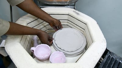 Items being placed in the kiln.
