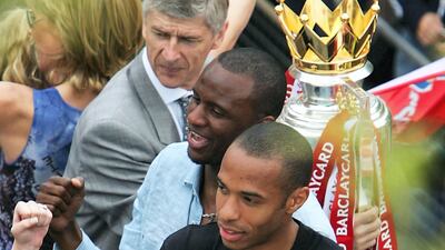 -Thierry Henry, Patrick Vieira and Arsene Wenger celebrate during an open-top bus parade after winning the 2004 Premier League. Getty