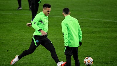 Lautaro Martinez (L) takes part in a training session in Madrid. AFP