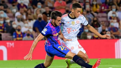 Barcelona defender Eric Garcia challenges Bayern Munich's Jamal Musiala. AFP