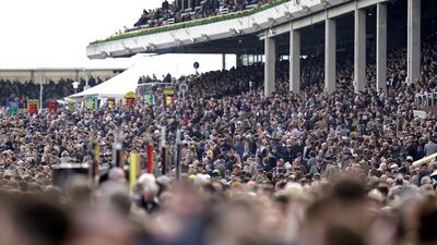 A packed stand during day one of the Cheltenham Festival. PA