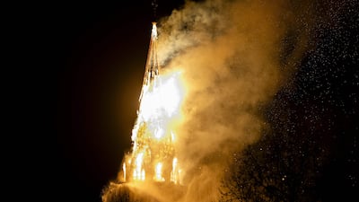 A fire rages inside the historic Vondelkerk church tower in Amsterdam on New Year's Eve. AFP