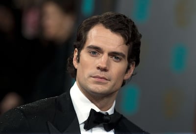 British actor Henry Cavill poses on the red carpet. ANDREW COWIE / AFP PHOTO