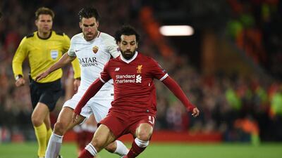 Liverpool's Mohamed Salah vies with Roma's Kevin Strootman. Oli Scarff / AFP