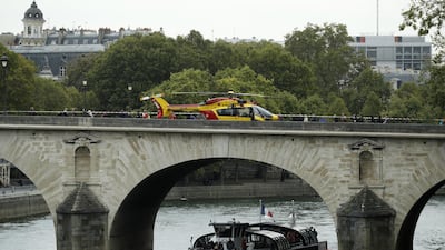 An emergency rescue services helicopter stands on a bridge. EPA