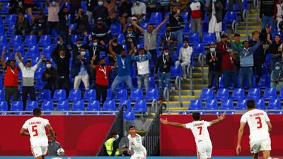 UAE players celebrate after scoring a goal.