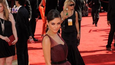 Mila Kunis wears Monique Lhuillier to the 2009 Primetime Emmy Awards. EPA
