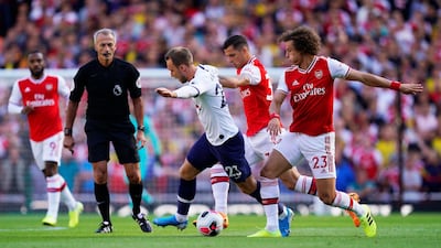 Arsenal's Granit Xhaxa in action against Tottenham's Christian Eriksen. EPA