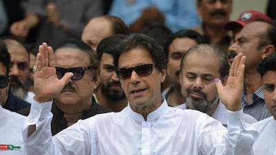 Imran Khan speaks to the media after casting his vote at a polling station during the general election in Islamabad on July 25. AFP