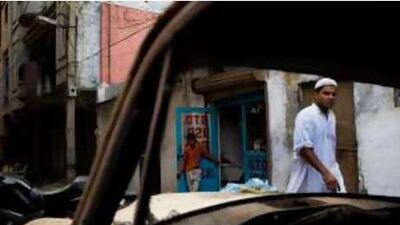 A local residents walk past the house where the shootout took place in L-18, Batla House, Jamia Nagar, New Delhi.