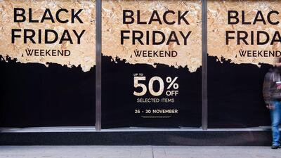Retail stores display "Black Friday" advertisements and banners on Oxford Street in central London (AFP PHOTO / OLI SCARFF)